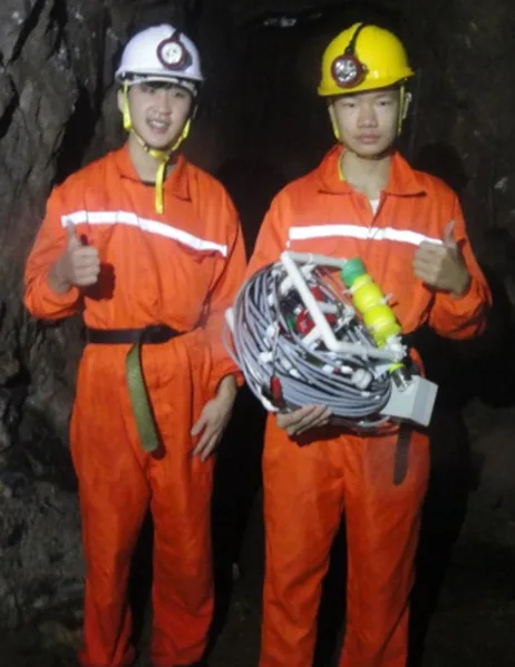 Young researchers holding an ROV during cave fieldwork